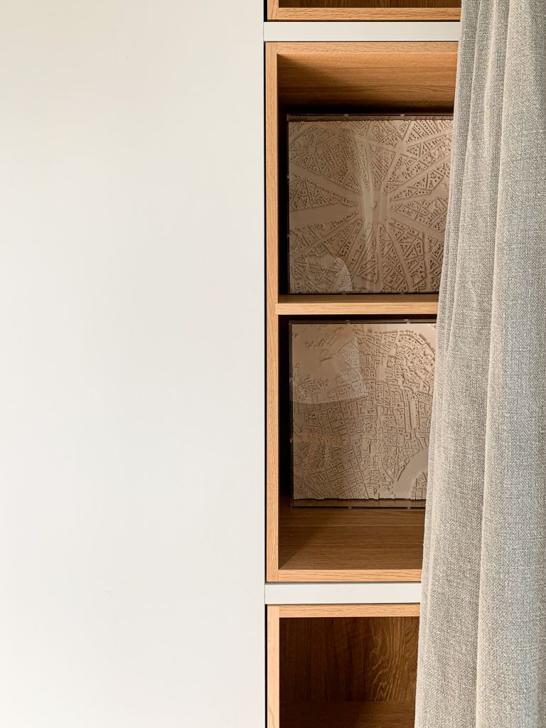 Cabinet with oak lined boxes and scale models of cities