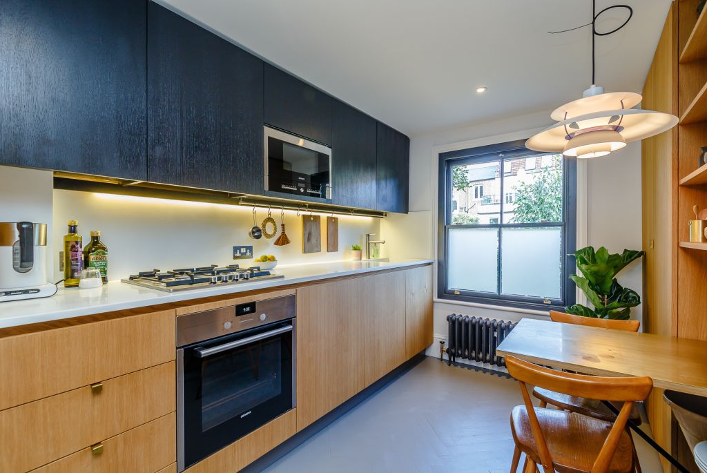 galley kitchen in natural and blacken oak
