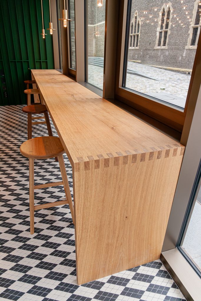 bar high table with finger joint detail and oak and walnut stools