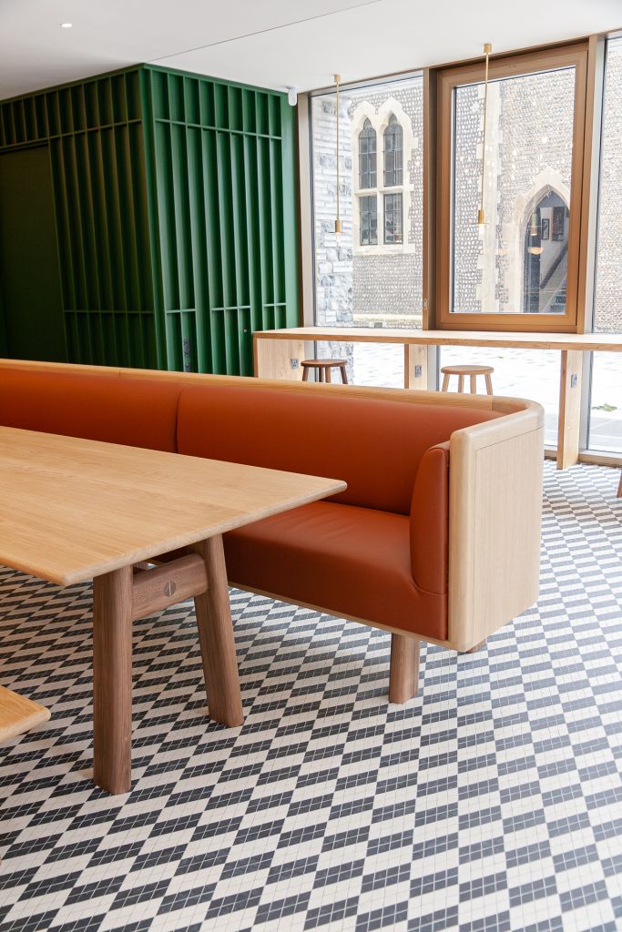 cafe seating in oak and tan leather.